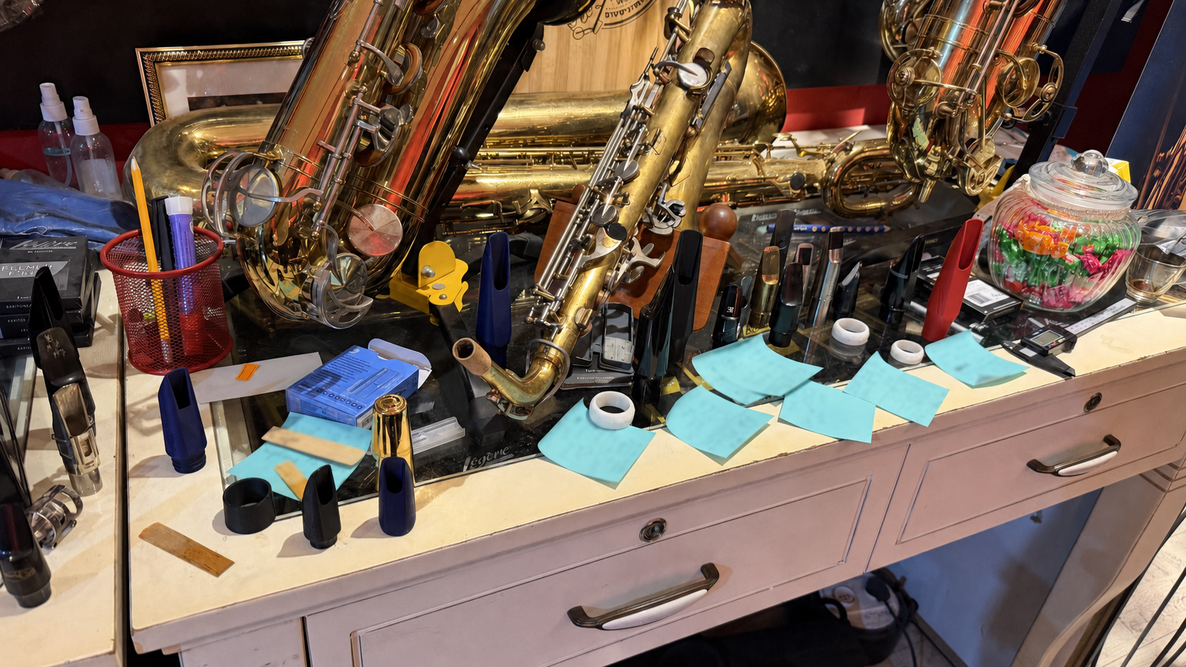 Saxophone Institute workshop counter with saxophones, mouthpieces and ligatures